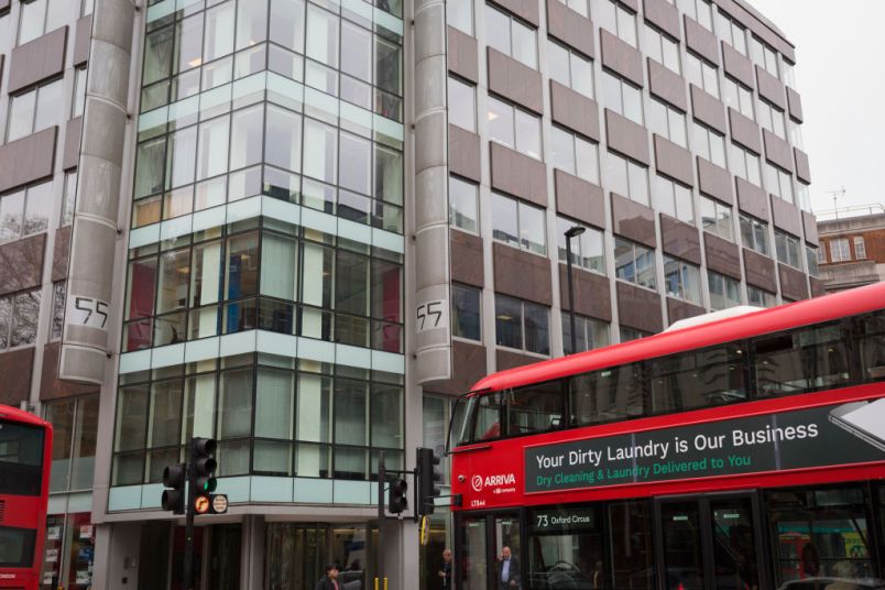A London bus with an ad for dirty washing drives past the offices of Cambridge Analytica on New Oxford Street, the UK tech company accused of harvesting the personal details of Facebook users in its data privacy scandal, on 11th April, 2018, in London, England. (Photo by Richard Baker / In Pictures via Getty Images)