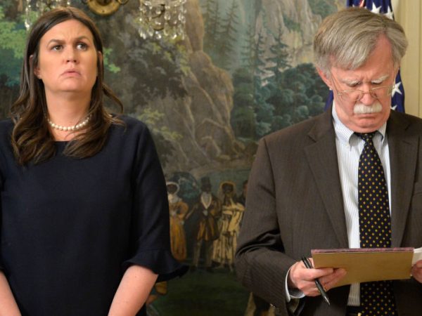 White House Press Secretary Sarah Huckabee Sanders (L) and National Security Advisor John Bolton listen to remarks by President Donald Trump as he speaks to the nation, announcing military action against Syria for the recent gas attack on civilians, at the White House, April 13, 2018, in Washington, DC.        ISP POOL Photo by Mike Theiler/UPI