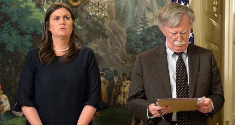 White House Press Secretary Sarah Huckabee Sanders (L) and National Security Advisor John Bolton listen to remarks by President Donald Trump as he speaks to the nation, announcing military action against Syria for the recent gas attack on civilians, at the White House, April 13, 2018, in Washington, DC.        ISP POOL Photo by Mike Theiler/UPI