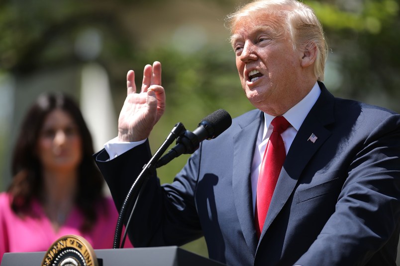 U.S. President Donald Trump signs an executive order during an event in the Rose Garden to mark the National Day of Prayer at the White House May 3, 2018 in Washington, DC. The White House invited leaders from varios faiths and religions to participate in the day of prayer, which was designated in 1952 by the United States Congress to ask people "to turn to God in prayer and meditation."