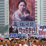 Tens of thousands of men and women pump their fists in the air and chant as they carry placards with anti-American propaganda slogans at Pyongyang's central Kim Il Sung Square on Sunday, June 25, 2017, in North Korea, to mark what North Korea calls "the day of struggle against U.S. imperialism" – the anniversary of the start of the Korean War. (AP Photo/Jon Chol Jin)