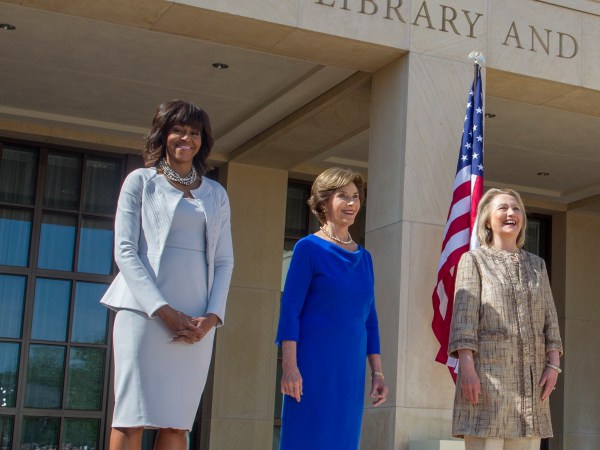 U.S. First Lady Michelle Obama (L) poses with former first ladies (2nd L-R) Laura Bush, Hillary Clinton, Barbara Bush and Rosalynn Carter as they attend the dedication ceremony for the George W. Bush Presidential Center in Dallas (Photo by Brooks Kraft LLC/Corbis via Getty Images)