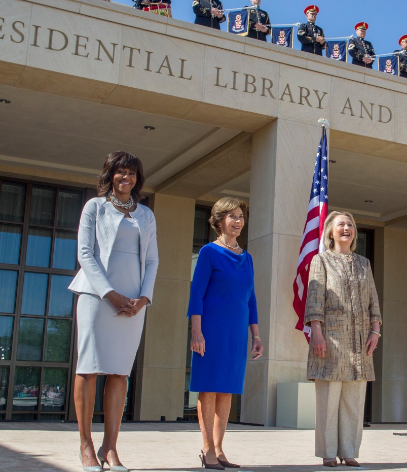 U.S. First Lady Michelle Obama (L) poses with former first ladies (2nd L-R) Laura Bush, Hillary Clinton, Barbara Bush and Rosalynn Carter as they attend the dedication ceremony for the George W. Bush Presidential Center in Dallas (Photo by Brooks Kraft LLC/Corbis via Getty Images)