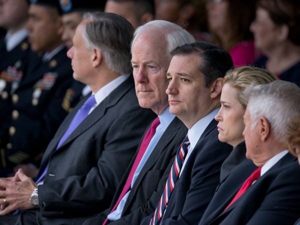 U.S. Senators John Cornyn, l, and Ted Cruz of Texas pause as dozens of Purple Hearts and two Defense of Freedom Medals were awarded at Fort Hood, Texas to victims and family of the 2009 terrorist attack.   Maj. Nadal Hasan is on death row for the attack that claimed 12 lives and wounded dozens.