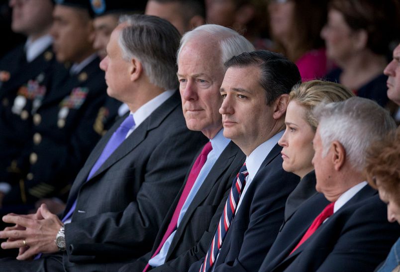 U.S. Senators John Cornyn, l, and Ted Cruz of Texas pause as dozens of Purple Hearts and two Defense of Freedom Medals were awarded at Fort Hood, Texas to victims and family of the 2009 terrorist attack.   Maj. Nadal Hasan is on death row for the attack that claimed 12 lives and wounded dozens.
