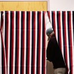 MANCHESTER, NH - JANUARY 08:  A man marks his ballot in a voting booth January 8, 2008 in Manchester, New Hampshire.  Record turnout for the nation's first primary was expected.  (Photo by Chris Hondros/Getty Images)