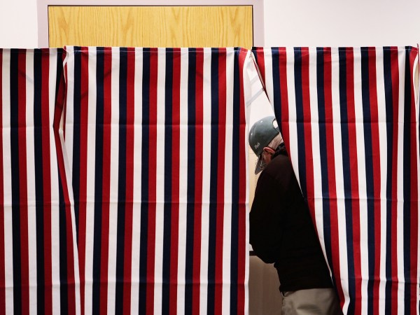 MANCHESTER, NH - JANUARY 08:  A man marks his ballot in a voting booth January 8, 2008 in Manchester, New Hampshire.  Record turnout for the nation's first primary was expected.  (Photo by Chris Hondros/Getty Images)