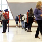PORTLAND, ME - NOVEMBER 7: Sue Vittner, right, walks her completed ballot to the scanning booth at the Merrill Auditorium voting station Tuesday morning. Turnout at the station has been “pretty good,” according to Election Warden Carol . By 8:20 a.m., the site had processed ballots from 95 voters, which Morrissette estimated was already three times as many voters who cast ballots at the same station during the May election. (Staff photo by Ben McCanna/Staff Photographer)