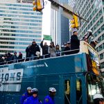 PHILADELPHIA, PA - FEBRUARY 08: (L-R) Team owner Jeffrey Lurie, with quarterbacks Nick Foles #9, Nate Sudfeld #7 and Carson Wentz #11 of the Philadelphia Eagles, acknowledge fans as Sudfeld hoists the Vince Lombardi Trophy atop a parade bus during festivities on February 8, 2018 in Philadelphia, Pennsylvania. The city celebrated the Philadelphia Eagles' Super Bowl LII championship with a victory parade. (Photo by Corey Perrine/Getty Images)