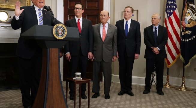 U.S. President Donald Trump signs the 'Section 232 Proclamations' on steel and aluinum imports in Roosevelt Room the the White House March 8, 2018 in Washington, DC. Trump announced a week earlier that he will put a 25-percent tarriff on steel and a 10-percent tarriff on alumninum.