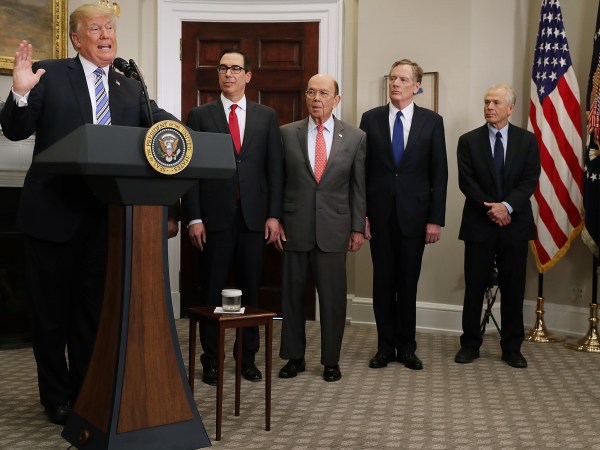 U.S. President Donald Trump signs the 'Section 232 Proclamations' on steel and aluinum imports in Roosevelt Room the the White House March 8, 2018 in Washington, DC. Trump announced a week earlier that he will put a 25-percent tarriff on steel and a 10-percent tarriff on alumninum.