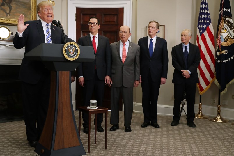 U.S. President Donald Trump signs the 'Section 232 Proclamations' on steel and aluinum imports in Roosevelt Room the the White House March 8, 2018 in Washington, DC. Trump announced a week earlier that he will put a 25-percent tarriff on steel and a 10-percent tarriff on alumninum.