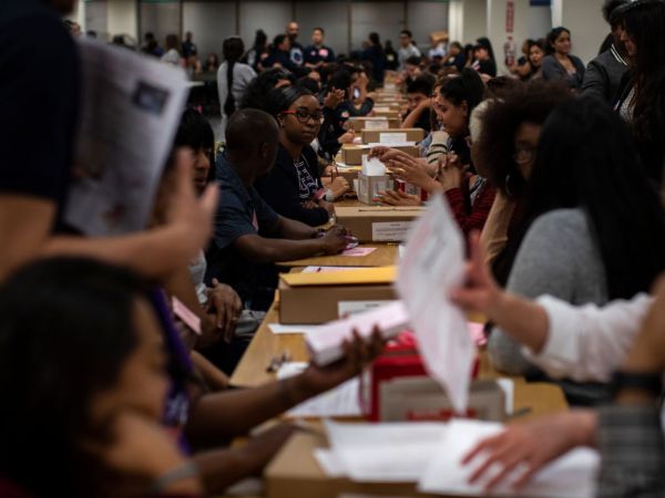 NORWALK, CA - JUNE 5,  2018:  Ballot inspectors check ballots for any damage before they are counted at the LA County Registrar-Recorder office on June 5, 2018 in Norwalk, California.(Gina Ferazzi/Los AngelesTimes)