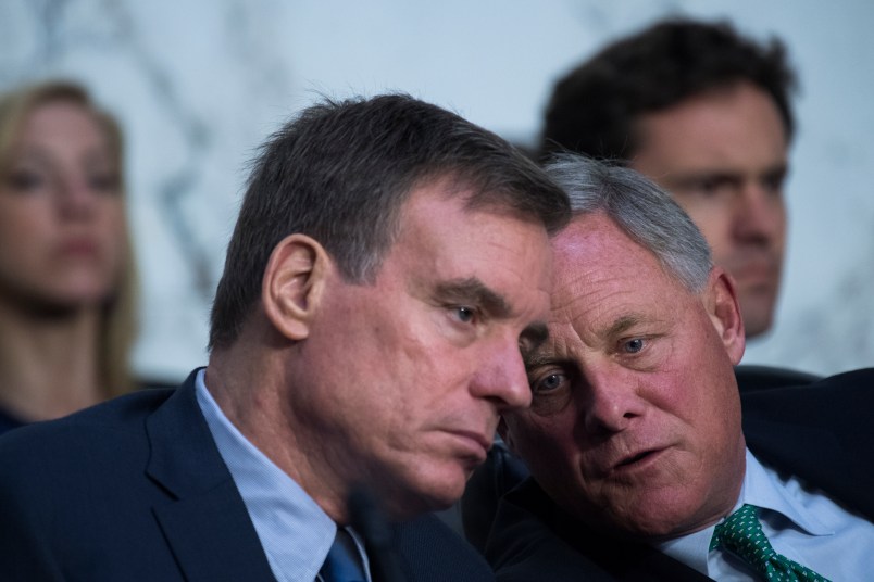 UNITED STATES - JUNE 20: Chairman Richard Burr, R-N.C., right, and Vice Chairman Mark Warner, D-Va., conduct a Senate (Select) Intelligence Committee hearing in Hart Building titled “Policy Response to Russian Interference in the 2016 U.S. Elections,” on June 20, 2018. Michael Daniel, former White House Cybersecurity Coordinator and Special Assistant to President Obama, and Amb. Victoria Nuland, former Assistant Secretary of State for European and Eurasian Affairs, testified. (Photo By Tom Williams/CQ Roll Call)