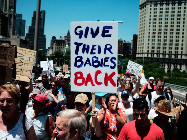NEW YORK, June 30, 2018 -- People march across the Brooklyn Bridge during the "Families Belong Together" rally in New York, the United States, on June 30, 2018. Tens of thousands of Americans marched and rallied across the United States to protest the Trump administration's "zero tolerance" immigration policy resulting in over 2,000 children separated from their families who crossed the border illegally. (Xinhua/Li Muzi)