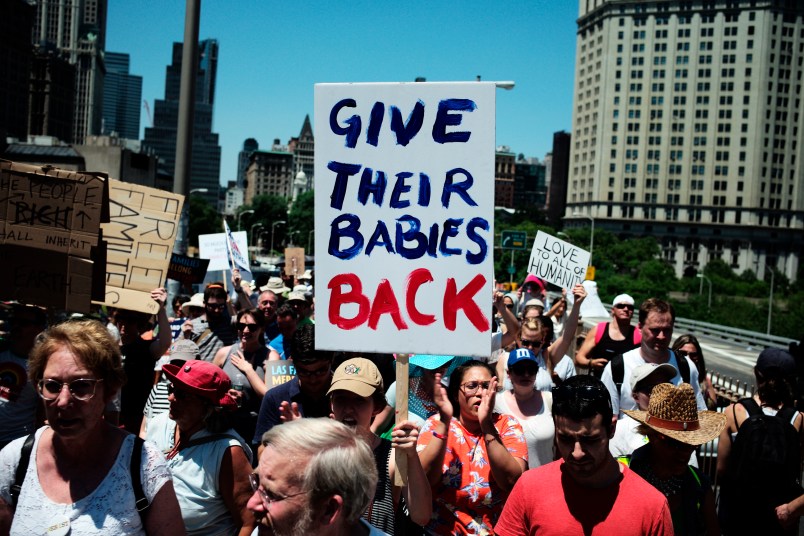 NEW YORK, June 30, 2018 -- People march across the Brooklyn Bridge during the "Families Belong Together" rally in New York, the United States, on June 30, 2018. Tens of thousands of Americans marched and rallied across the United States to protest the Trump administration's "zero tolerance" immigration policy resulting in over 2,000 children separated from their families who crossed the border illegally. (Xinhua/Li Muzi)