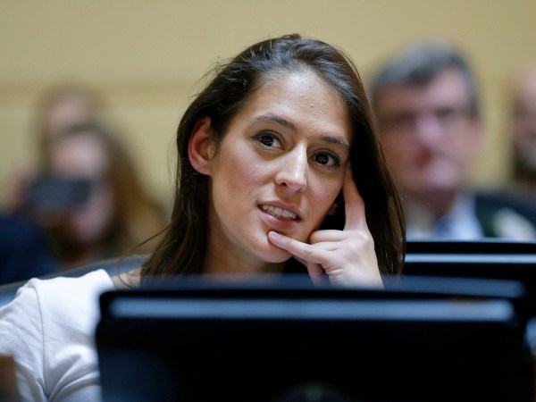 FILE - In this Jan. 3, 2017 file photo, Rhode Island state Rep. Moira Walsh, D-Providence, listens during swearing-in ceremonies in the House Chamber at the Statehouse in Providence, R.I. State Democrats endorsed a Donald Trump-voting male candidate over Walsh in late June, 2018, who is known for championing liberal causes in a district voted overwhelmingly for Hillary Clinton for president. (AP Photo/Steven Senne, File)