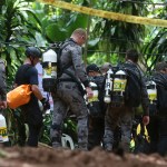 International rescuers team prepare walk in of a cave where a young soccer team and their coach are believed to be missing, Thursday, July 5, 2018, in Mae Sai, Chiang Rai province, in northern Thailand. With more rain coming, Thai rescuers are racing against time to pump out water from a flooded cave before they can extract 12 boys and their soccer coach with minimum risk, officials said Thursday. (AP Photo/Sakchai Lalit)