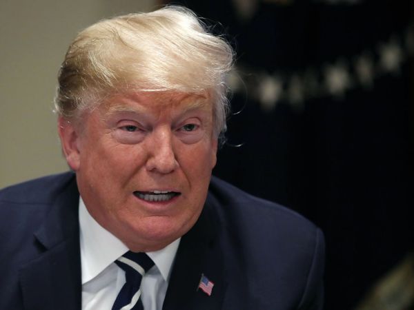 WASHINGTON, DC - JULY 17:  U.S. President Donald Trump talks the media about his meeting with RussianÊVladimir Putin in Helsinki, in the Cabinet Room on July 17, 2018 in Washington, DC. President Trump was holding a meeting with House members of the Ways and Means Committee.  (Photo by Mark Wilson/Getty Images)