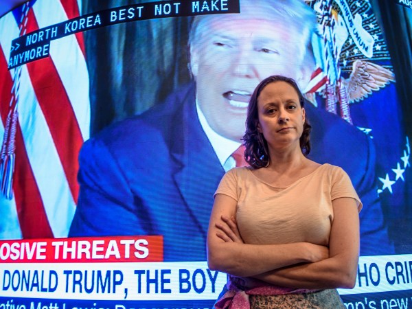 Saying it was a sign of respect for her country and not disrespect, Haddam, Conn., Selectwoman Melissa Schlag took a knee during the pledge of allegiance before Haddam's July 19, 2018, board meeting. Schlag said she was moved to protest after Trump's meeting with Vladimir Putin and the country's caging of migrant children. (Mark Mirko/Hartford Courant/TNS)