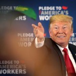 PEOSTA, IA - JULY 26:  President Donald Trump tosses a "Make Farmers Great Again" hat to guests following a roundtable discussion at Northeast Iowa Community College on July 26, 2018 in Peosta, Iowa. The stop is the first of two Midwest stops the president has scheduled for today. Later this afternoon Trump will visit U.S. Steel’s Granite City Works near St. Louis.  (Photo by Scott Olson/Getty Images)