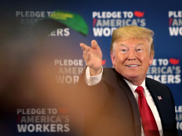 PEOSTA, IA - JULY 26:  President Donald Trump tosses a "Make Farmers Great Again" hat to guests following a roundtable discussion at Northeast Iowa Community College on July 26, 2018 in Peosta, Iowa. The stop is the first of two Midwest stops the president has scheduled for today. Later this afternoon Trump will visit U.S. Steel’s Granite City Works near St. Louis.  (Photo by Scott Olson/Getty Images)