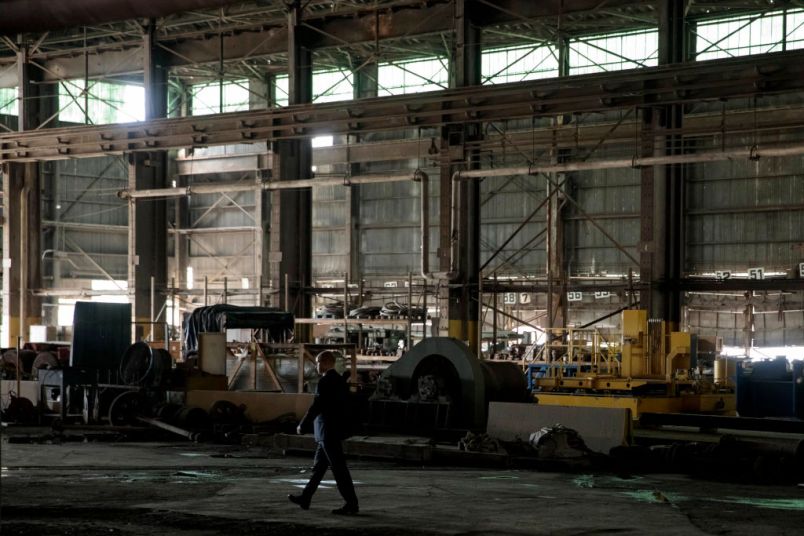 GRANITE CITY, IL - JULY 26: A Secret Service agent walks through a steel coil warehouse before President Donald Trump's visit on July 26, 2018 at U.S. Steel's Granite City Works plant in Granite City, Illinois. (Photo by Whitney Curtis/Getty Images)