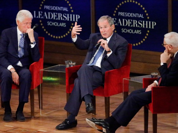 DALLAS, TX - JULY 13: Former president George W. Bush answers a question from moderator David Rubenstein (R) while former president Bill Clinton (L) looks on at the Presidential Leadership Scholars Graduation Ceremony at the George W. Bush Institue  on July 13, 2017 in Dallas, Texas. (Photo by Stewart  F. House/Getty Images)