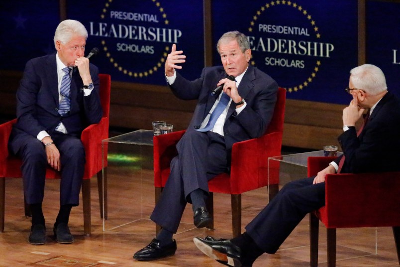 DALLAS, TX - JULY 13: Former president George W. Bush answers a question from moderator David Rubenstein (R) while former president Bill Clinton (L) looks on at the Presidential Leadership Scholars Graduation Ceremony at the George W. Bush Institue  on July 13, 2017 in Dallas, Texas. (Photo by Stewart  F. House/Getty Images)