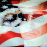 An American flag is seen with a portrait of Russian president Vladimir Putin in this photo illustration on October 31, 2017. Material posted on Facebok and other social media directly and indirectly reached over 126 million Americans between 2015 and 2017 according to a company testimony that will be presented to the US Senate judiciary committe on Tuesday. (Photo by Jaap Arriens/NurPhoto)