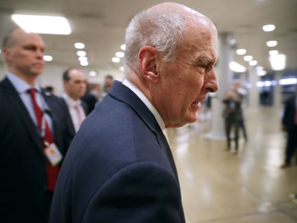 Federal Bureau of Investigation Director Christopher Wray and Director of National Intelligence Daniel Coats arrive to brief members of the so-called 'Gang of Eight' at the U.S. Capitol May 24, 2018 in Washington, DC. The bipartisan group of senators and representatives requested a briefing from the intelligence officials about the FBI's use of a confidential intelligence source in the Russia investigation. The "Gang of Eight" consists of the top Republican and Democratic members of the House and Senate intelligence committee as well as congressional leaders from both parties.