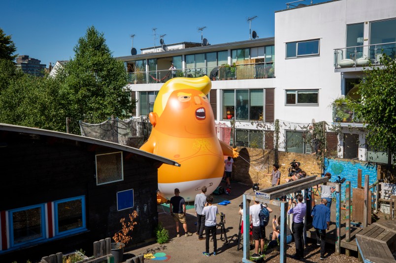 The Trump Baby sitting team give the six metre high inflatable TrumpBaby his first London outing inside the disused North London playground, Islington, London, United Kingdom. 26th June 2018. The plan, is to fly him above Parliament Square in Westminster when the real Trump, president of the United States arrives in the United Kingdom on the 13th of July 2018.  (photo by Andrew Aitchison / In pictures via Getty Images)