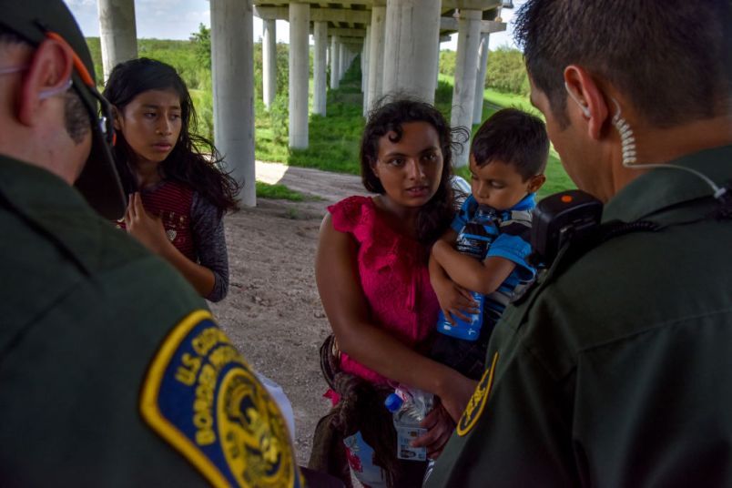 MISSION, TX - JUNE 27:Families from Guatemala are detained by United States Border Patrol agents for illegally crossing the U.S.-Mexico border along the Rio Grande on Wednesday, June 27, 2018, in Mission, TX. They ended up directly underneath a legal port of entry – Anzalduas International Bridge.(Photo by Jahi Chikwendiu/The Washington Post)