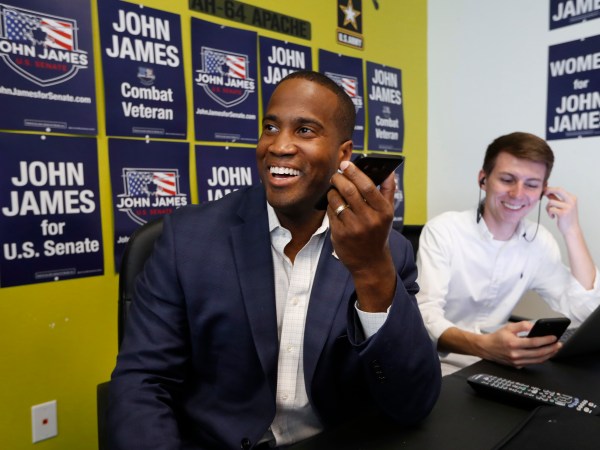 Republican U.S. Senate candidate John  James makes a campaign call at his headquarters in Livonia, Mich., Monday, Aug. 6, 2018. (AP Photo/Paul Sancya)