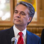 Kansas governor Jeff Colyer talks to reporters in Topeka, Kan., on Wednesday, Aug. 8, 2018, a day after his primary race against Kansas Secretary of State Kris Kobach. Colyer is currently 191 votes behind Kobach and is awaiting the results of mail-in and provisional ballots. (AP Photo/The Wichita Eagle, Travis Heying)