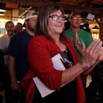 Vermont Democratic gubernatorial candidate Christine Hallquist, a transgender woman and former electric company executive, applauds with her supporters during her election night party in Burlington, Vt., Tuesday, Aug. 14, 2018. (AP Photo/Charles Krupa)