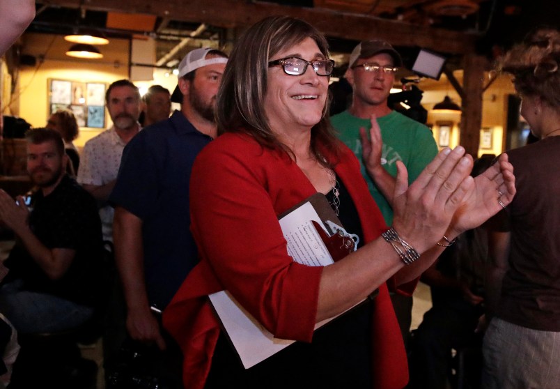 Vermont Democratic gubernatorial candidate Christine Hallquist, a transgender woman and former electric company executive, applauds with her supporters during her election night party in Burlington, Vt., Tuesday, Aug. 14, 2018. (AP Photo/Charles Krupa)
