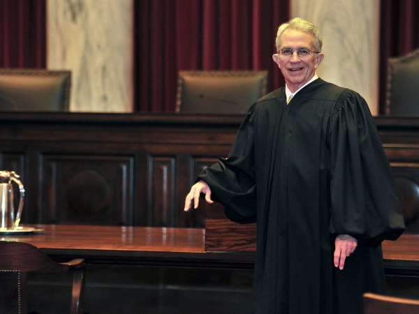ADVANCE FOR SUNDAY JAN. 15 AND THEREAFTER- In this Thursday Jan. 5, 2012 photo West Virginia Supreme Court of Appeals Chief Justice Menis Ketchum poses in his robe in the court chambers in Charleston, W. Va. Menis Ketchum began a one-year rotation as chief justice on Jan. 1.  (AP Photo/Charleston Daily Mail, Bob Wojcieszak)