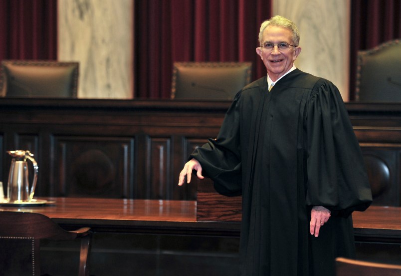ADVANCE FOR SUNDAY JAN. 15 AND THEREAFTER- In this Thursday Jan. 5, 2012 photo West Virginia Supreme Court of Appeals Chief Justice Menis Ketchum poses in his robe in the court chambers in Charleston, W. Va. Menis Ketchum began a one-year rotation as chief justice on Jan. 1.  (AP Photo/Charleston Daily Mail, Bob Wojcieszak)