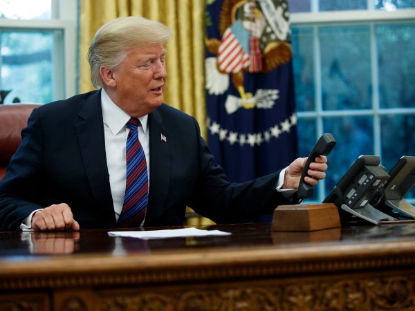 President Donald Trump talks with Mexican President Enrique Pena Nieto on the phone about a trade agreement between the United States and Mexico, in the Oval Office of the White House, Monday, Aug. 27, 2018, in Washington. (AP Photo/Evan Vucci)