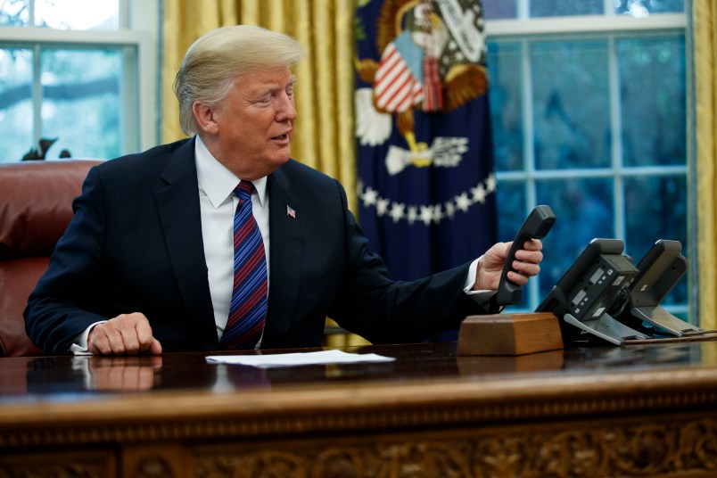 President Donald Trump talks with Mexican President Enrique Pena Nieto on the phone about a trade agreement between the United States and Mexico, in the Oval Office of the White House, Monday, Aug. 27, 2018, in Washington. (AP Photo/Evan Vucci)