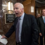 Senate Armed Services Chairman John McCain, R-Ariz., followed at right by House Armed Services Chairman Mac Thornberry, R-Texas, makes a humorous face to reporters as he arrives to speak before a meeting of the National Defense Authorization Act conferees, on Capitol Hill in Washington, Wednesday, Oct. 25, 2017.  (AP Photo/J. Scott Applewhite)
