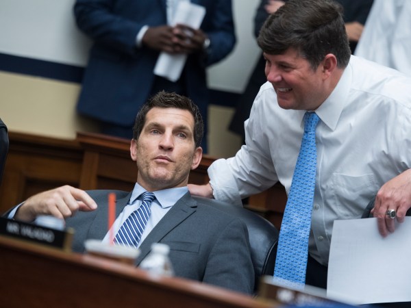 UNITED STATES - JULY 25: Reps. Scott Taylor, R-Va., left, and Steven Palazzo, R-Miss., House Appropriations Committee markup of the FY 2019 Homeland Security Appropriations Bill in Rayburn Building on July 25, 2018. (Photo By Tom Williams/CQ Roll Call)