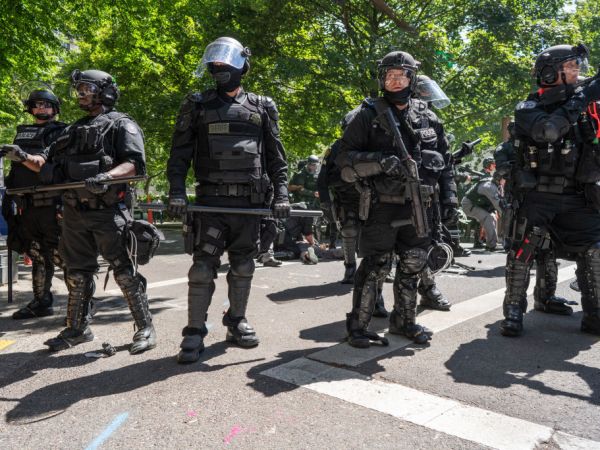 PORTLAND, OREGON, UNITED STATES - 2018/08/04: Police seen in downtown Portland during the Patriot Prayer Rally.The Proud Boys organized the Patriot Prayer Rally in Portland. The Proud Boys, a far right group supportive of President Donald Trump, used inflammatory language ahead of their rally, with some members promising violence. Counter-protesters led by Antifa confronted the participants of the Patriot Prayer Rally and clashed with police, leading to arrests and injuries. (Photo by Kainoa Little/SOPA Images/LightRocket via Getty Images)