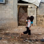 GAZA CITY, THE GAZA STRIP, GAZA - 2018/08/25: Palestinian refugee kids seen playing outside their temporary home in the northern Gaza Strip town of Beit Lahiya.The United States cancelled more than two hundred million dollars in aid for the Palestinian refugees in the Gaza Strip and West Bank. (Photo by Mahmoud Issa/SOPA Images/LightRocket via Getty Images)