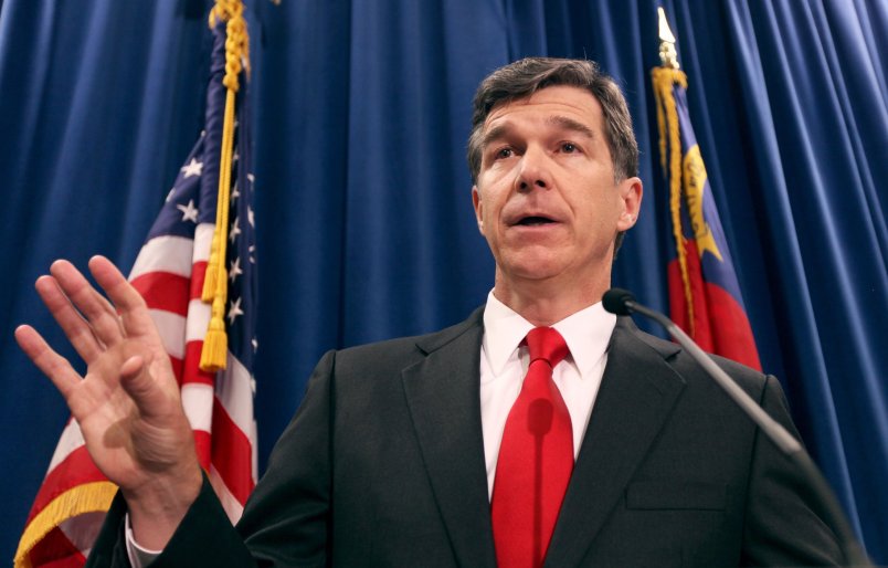 North Carolina Attorney General Roy Cooper, a Democrat, has condemned his state's Republican-sponsored voter ID law and constitutional amendment to ban same-sex marriage. But in his position he must defend the state against lawsuits on both issues. (Takaaki Iwabu/Raleigh News & Observer/MCT)