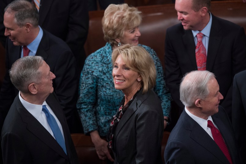 UNITED STATES - FEBRUARY 28: Secretary of Education Betsy DeVos,  is seen with other cabinet members in the House Chamber before President Donald Trump addressed a joint session of Congress in the Capitol, February 28, 2017. (Photo By Tom Williams/CQ Roll Call)