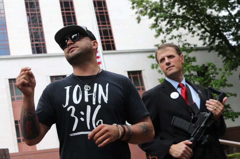 SEATTLE, WA - MAY 20: Joey Gibson (left), leader of the Patriot Prayer group, speaks during a rally advocating the right to openly carry guns in public, on May 20, 2018 in Seattle, Washington. Gibson is running for US Senate as a Republican. Mark Callahan (right), is running for a legislative position in Oregon (OR-5). (Photo by Karen Ducey/Getty Images)