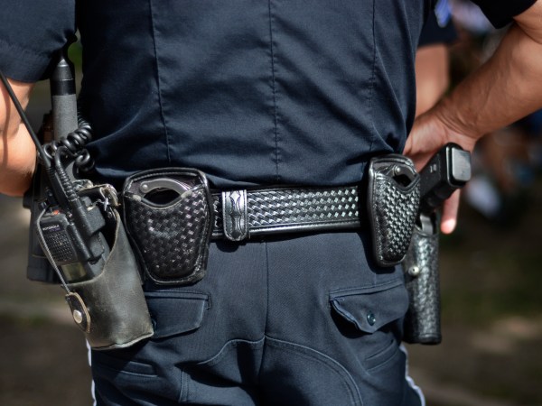 SANTA FE, NM - JULY 4, 2018:  A police officer keeps an eye on the crowd at a Fourth of July holiday event in Santa Fe, New Mexico. (Photo by Robert Alexander/Getty Images)