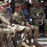 Outgoing U.S. Army Gen. John Nicholson, second left, listens as incoming U.S. Army Gen. Austin Miller, third left, looks at him, before the change of command ceremony starts, at Resolute Support headquarters, in Kabul, Afghanistan, Sunday, Sept. 2, 2018. U.S. Army Gen. Austin Miller has assumed command of the 41-nation NATO mission in Afghanistan following a handover ceremony. (AP Photo/Massoud Hossaini)